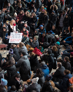 Cassandra Schmitt, a student of Syracuse University, uses a megaphone to speak during a protest on the campus of Syracuse University. The march was in retaliation of President Trump's ban on refugees that was recently passed.