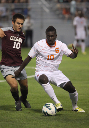 Tony Asante dribbles away from a Colgate defender in Syracuse's 6-0 win over the Raiders Monday. 