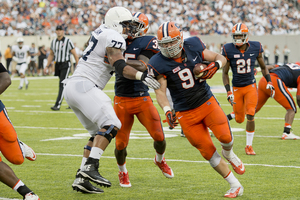 Defensive end Robert Welsh barrels toward the end zone after hauling in his first career interception. He was brought down at the 1-yard line.