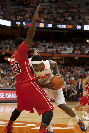 C.J. Fair tries to power through St. Francis (N.Y.) forward Lowell Ulmer. The Syracuse forward scored just seven points on 2-of-13 shooting.