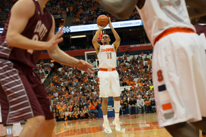 Tyler Ennis lines up for a 3-pointer in Syracuse's 69-50 win against Colgate on Saturday. The freshman made four 3s on the afternoon.