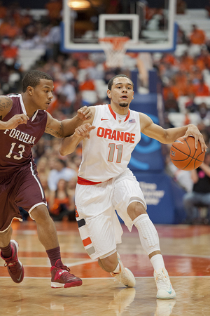 Tyler Ennis drives past Fordham guard Chris Whitehead. Ennis finished with 16 points, five assists and four steals in SU's 89-74 win on Tuesday.