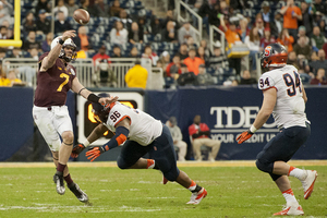 Jay Bromley rushes Minnesota quarterback Mitch Leidner in the backfield.