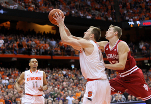 Trevor Cooney is hacked by Indiana forward Austin Etherington during No. 4 Syracuse's 69-52 win over the Hoosiers on Tuesday. Cooney finished with a game-high 21 points on 5-of-9 shooting from 3-point range.