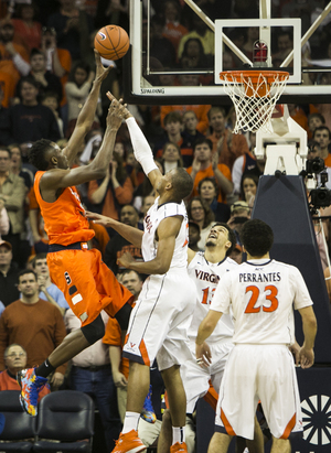 Jerami Grant goes up for a layup in the first half of No. 4 Syracuse's 75-56 win over No. 12 Virginia on Saturday. Grant was sidelined for the entire second half for the second straight game. 