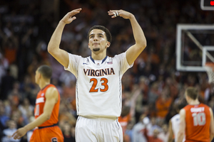 Virginia freshman London Parrantes pumps up the crowd in Virginia's 75-56 win over Syracuse on Saturday. Perrantes finished with six points and seven assists. 