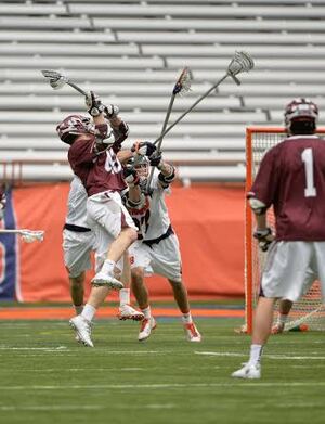 A duo of Syracuse defenders defend a Colgate shot in the Orange's 19-6 win over the Raiders on Saturday. 