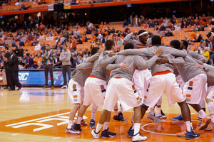 Syracuse circles around sophomore forward B.J. Johnson before its victory over Kennesaw State, during which Johnson set a career-high with 19 points.