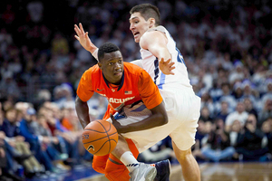 Kaleb Joseph looks to evade Villanova's Ryan Arcidiacono. Joseph finished with 10 points and 10 assists in an improved performance from his last time out.