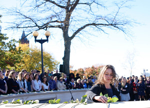 Former Lockerbie Scholar Megan Noble laid a rose in memory of a victim of the Pan Am Flight 103 bombing at last year's Rose Laying Ceremony.