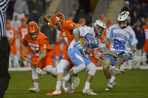 Ben Williams and Stephen Kelly of UNC (No. 24) get tangled after a faceoff in the 2015 conference semifinal game. Kelly is having the best year of his career and will face Williams at the X on Saturday.