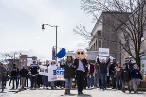 The march started on the corner of South Franklin and Walton streets and ended in front of the Chase building on South Salina Street.  