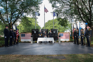 Syracuse Mayor Stephanie Miner and other city officials observe a moment of silence at last year's 9/11 ceremony in downtown Syracuse. 