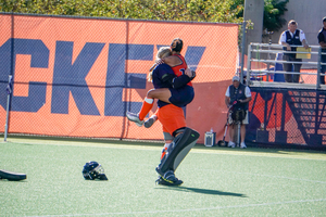 Hurff and van der Velde embrace after Syracuse's 1-0 over Princeton on Oct. 1.