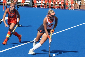 Carolin Hoffman dribbles the ball upfield in the Orange's 1-0 season opener loss at Virginia.