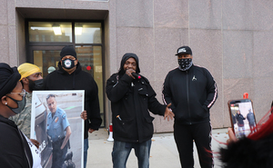 About 20 people protested outside the county sheriff’s office.
