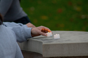 Remembrance Scholars led a procession during the Candlelight Vigil from Hendricks Chapel to the Place of Remembrance, where some attendees lit candles in memory of those who died in the Pan Am Flight 103 bombing.