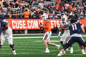 Syracuse quarterback Kyle McCord (orange jersey) and running back LeQuint Allen Jr. have been named to the preseason watchlist for the 2024 Maxwell Award.