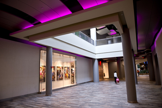 A shopper passes by one of the new stores.