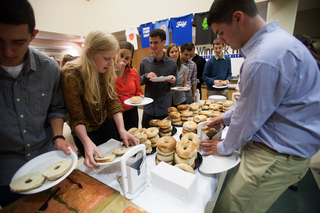 Jacquelyn Sparks, a freshman sports management major, grabs a bagel after fasting for the day.