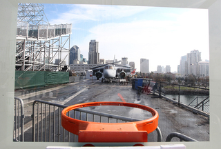 An airplane is seen through the view of a basketball backboard aboard the USS Midway Museum on Nov. 8, 2012 before the Battle on the Midway game between the Syracuse Orange and the San Diego State Aztecs.