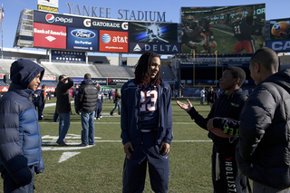 Running back Prince-Tyson Gulley chats with area youths during Friday morning's event at Yankee Stadium.