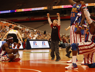 And finally, on his 11th attempt, their prayers were answered, as the fan's shot rolled around the rim and through the hoop.