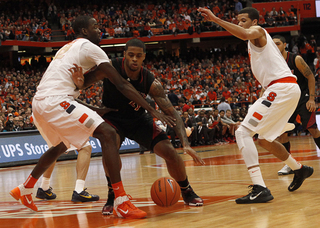 Baye Moussa Keita defends Chane Behanan in the paint. Keita played just 14 minutes, grabbing three rebounds and turning in an assist.