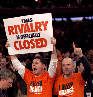 John Groat (left) a Syracuse local, and Denis Hickey (right), of Camillus cheer at the end of Syracuse vs. Georgetown matchup at Madison Square Garden.