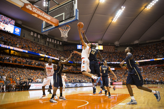 Ennis scores a pivotal basket against Zanna. Ennis led SU with 16 points and carried the Orange down the stretch.