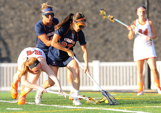 SU's Daley reaches for a groundball against UVA's Mary Alati.