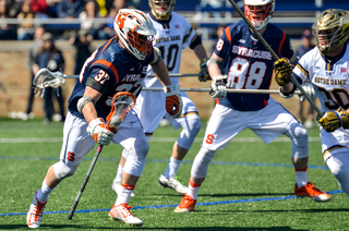 Ben Williams runs toward the net. He won 43 percent of his faceoffs. 