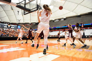 Mangakahia leaps throwing an inbounds pass.