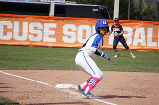 A Duke base runner takes a lead off third. 